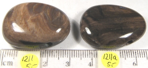 Foto Lederbandteile aus Edelsteinen: versteinertes Holz-Trommelsteine